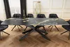 A dining room scene with a large extendable table and chairs. Produktbild-Vorschau