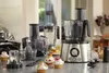 A collection of kitchen appliances and cupcakes on a countertop. Anteprima dell’immagine prodotto