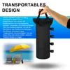 A hand holding a black bag, with text describing its features, and a beach scene with chairs and an umbrella in the background. Produktbild-Vorschau