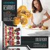 A woman is preparing dried fruit in a kitchen, with a food dehydrator shown with trays of dried vegetables. Náhľad obrázku produktu