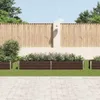 A garden scene with raised garden beds in front of a wooden fence. Produktbild-Vorschau