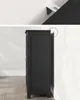 A dark gray cabinet is shown against a white wall. Náhled obrázku produktu