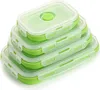 A stack of four green and clear collapsible silicone food storage containers with white lids. Náhled obrázku produktu