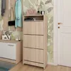 A hallway or entryway scene with a shoe cabinet, coat rack, and bench. Náhľad obrázku produktu