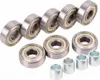 A collection of ball bearings and spacers arranged on a white background. Náhľad obrázku produktu