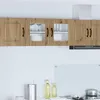 A kitchen scene with overhead cabinets, a range hood, and countertop items. Náhľad obrázku produktu