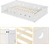 A white wooden children's bed with cut-out star and moon shapes on the side panels, shown from a diagonal angle. Three close-up detail shots are included below: one of the corner joinery, one of the wooden slats of the bed base, and one of a moon cut-out o Produktbild-Vorschau