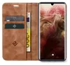 A brown leather flip case for a smartphone is open, showing the phone's screen and card slots. Produktbild-Vorschau