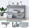 A gray console table with three shelves and a drawer, decorated with various items. Podgląd zdjęcia produktu
