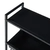 A close-up view of a black metal shelf unit. Produktbild-Vorschau