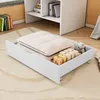 A white drawer with bedding and small boxes inside, placed on a rug in front of a white shelf unit. Anteprima dell’immagine prodotto