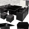 A rattan garden furniture set with a glass-topped table, chairs, and ottomans, along with a protective cover. Náhled obrázku produktu