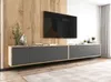 A modern living room with a wall-mounted TV and a floating entertainment unit. Produktbild-Vorschau
