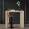 A bar table with a stool in front of it, set against a dark wall. Náhled obrázku produktu