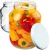 Two glass jars, one empty and one filled with pickled peppers, with a white lid next to it. Podgląd zdjęcia produktu