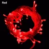 A coiled string of red LED lights against a black background. Produktbild-Vorschau