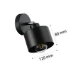 A black modern wall lamp with a visible light bulb and measurement indicators. Produktbild-Vorschau