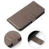 A flip-style phone case with a floral and butterfly embossed design, shown from a slightly elevated angle. Produktbild-Vorschau