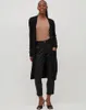 A woman modeling a black cardigan and black pants. Produktbild-Vorschau