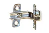 A close-up studio shot of a metal hinge against a white background. Produktbild-Vorschau