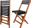 A folded and an unfolded wooden chair with black slats, shown against a white background. Anteprima dell’immagine prodotto
