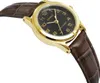 A close-up, angled view of a gold-toned Casio watch with a black face and a brown leather strap. Produktbild-Vorschau