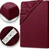 A close-up of a burgundy fitted sheet, with two inset circles showing a corner detail and a label. Produktbild-Vorschau