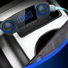 A Bluetooth FM transmitter is plugged into a car's power outlet and connected to a smartphone. Anteprima dell’immagine prodotto