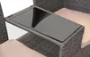 A close-up view of a poly-rattan bench with a glass-topped table integrated into the armrest. Anteprima dell’immagine prodotto
