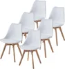 A set of six white dining chairs with wooden legs arranged in a staggered formation against a white background. Produktbild-Vorschau