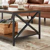 A close-up view of a coffee table in a living room setting, with a couch and rug visible. Produktbild-Vorschau
