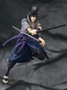 An action figure of Sasuke Uchiha from Naruto Shippuden in a dynamic pose with two swords. Produktbild-Vorschau