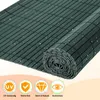 A rolled-up green privacy screen is shown, with four circular icons at the bottom highlighting product features. Produktbild-Vorschau