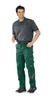 A man wearing work pants and a polo shirt, standing against a white background. Produktbild-Vorschau