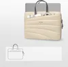 A laptop bag with accessories and a laptop shown inside. Produktbild-Vorschau