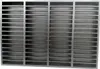 A dark gray, rectangular grid-like structure, possibly a vent or grate, is shown from a front-facing perspective. Produktbild-Vorschau