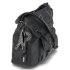 A black Rieker women's shoulder bag with a decorative charm. Náhled obrázku produktu
