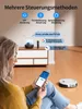 A woman is using a smartphone to control a robot vacuum cleaner, with a lamp and remote control on a cabinet in the background. Produktbild-Vorschau