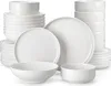 A collection of white ceramic dishes, including plates and bowls, stacked and arranged on a white background. Náhled obrázku produktu