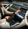 A person's hands are shown interacting with a large touchscreen display inside a car, showcasing the product's interface and features. Produktbild-Vorschau