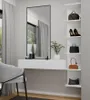A modern white floating vanity with a large mirror and a chair in a room. Produktbild-Vorschau