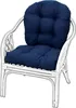 A white rattan chair with navy blue cushions. Produktbild-Vorschau