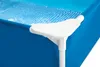 A close-up view of the corner of a blue rectangular swimming pool, showing a white plastic corner connector and part of the pool liner. Produktbild-Vorschau