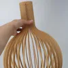 A hand is holding a wooden pendant lamp. Voir les images du produit