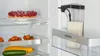 Inside a refrigerator, showing food items and a milk dispenser. Produktbild-Vorschau