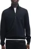 A man wearing a black half-zip pullover. Produktbild-Vorschau