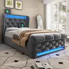 A modern upholstered bed with integrated LED lighting and charging ports, set in a bedroom environment. Produktbild-Vorschau