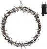 A circular string of lights with a plug. Produktbild-Vorschau