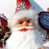 Close-up of a Santa Claus decoration with a Merry Christmas sign. Náhľad obrázku produktu