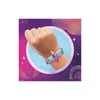 A hand wearing a colorful bracelet with a lightning bolt charm, set against a vibrant, abstract background. Náhled obrázku produktu